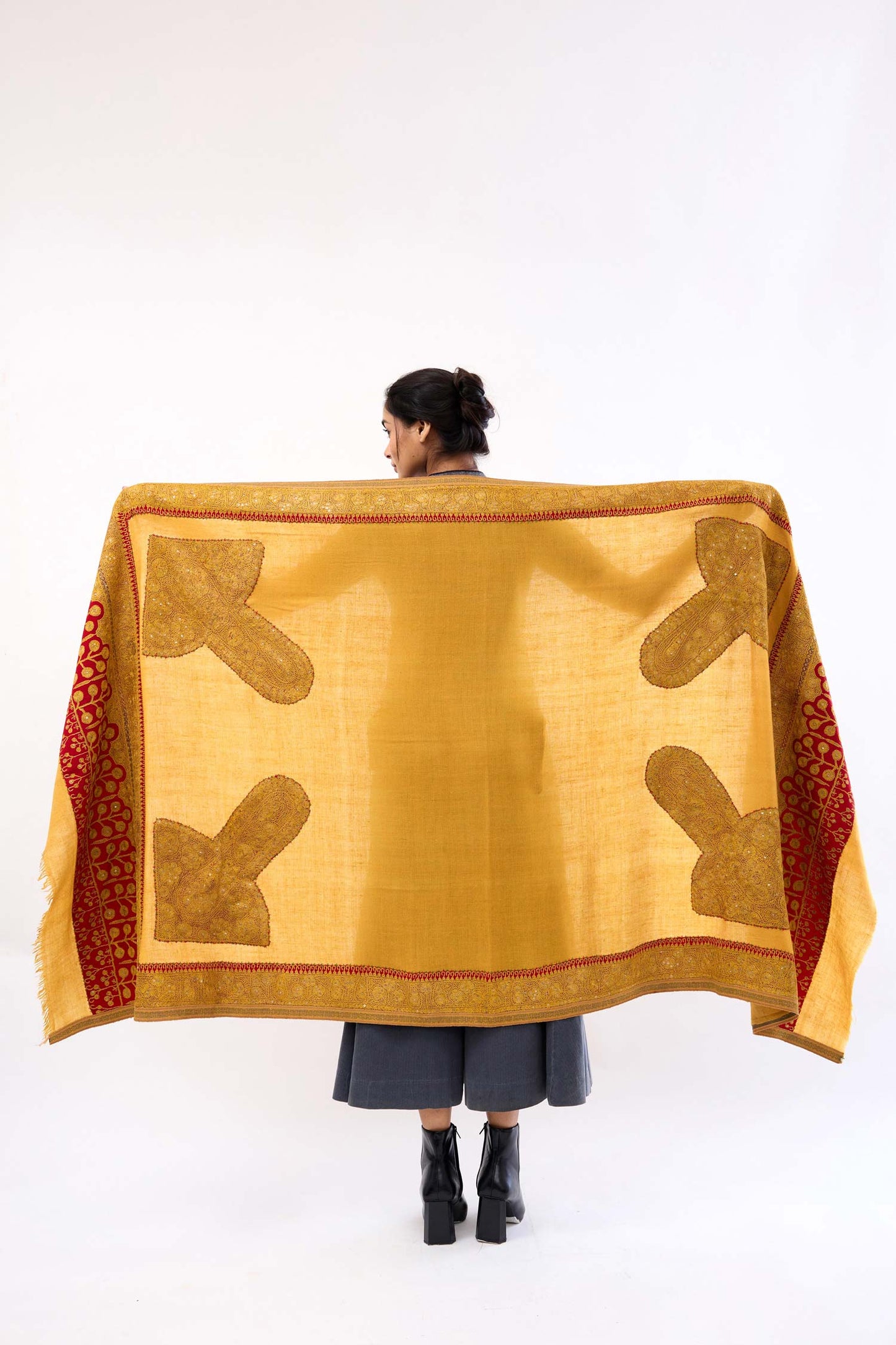 Elnaz Doshala in mustard and red